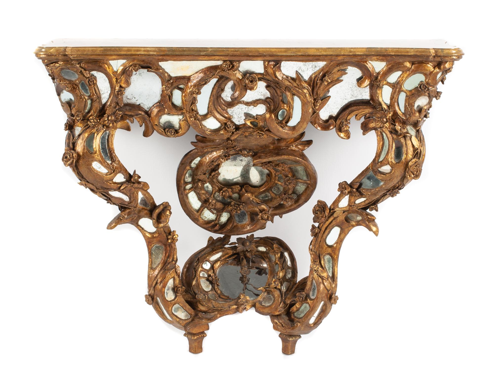 A Venetian Mirror-Inset Giltwood Console Table Height 34 x width 44 x depth 16 1/2 inches.