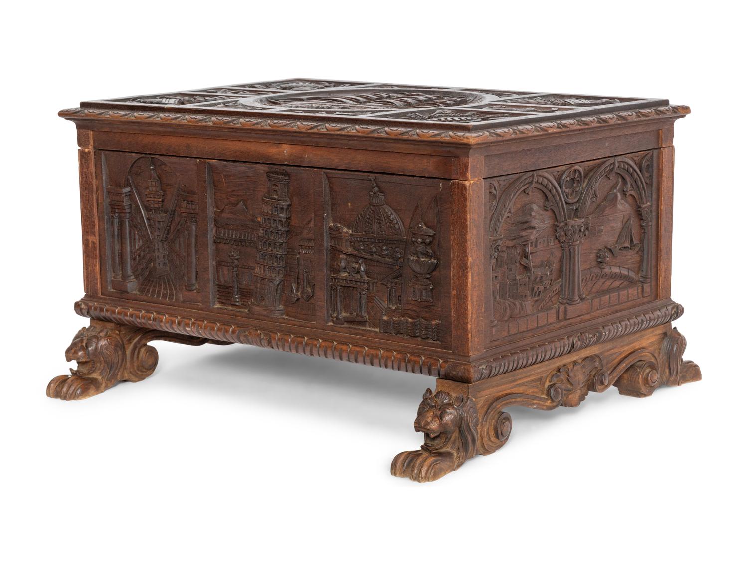 A Continental Carved Oak Lift-Top Trunk