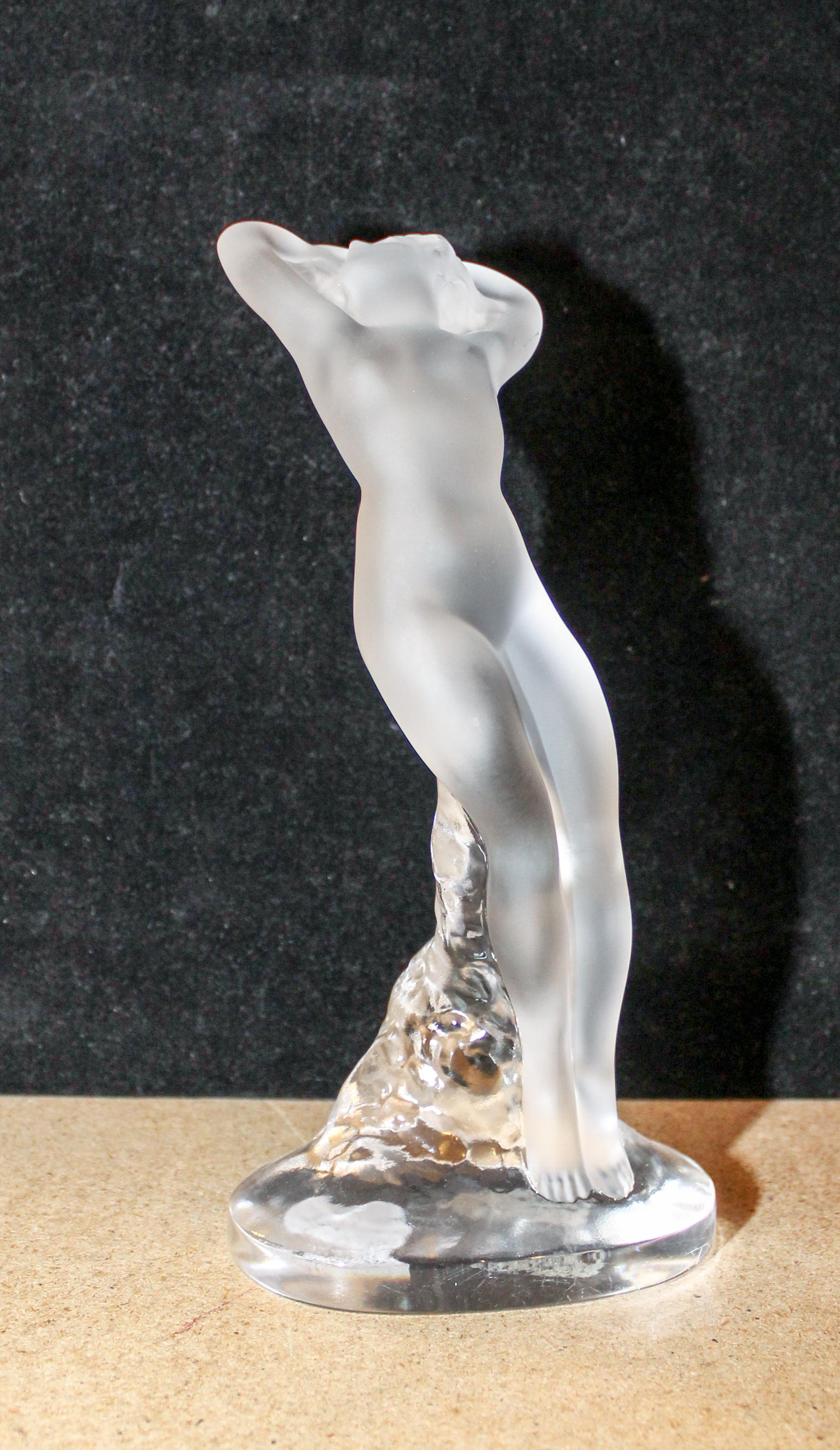 A Lalique Molded and Frosted Glass Figure. Height 9 1/4 inches.