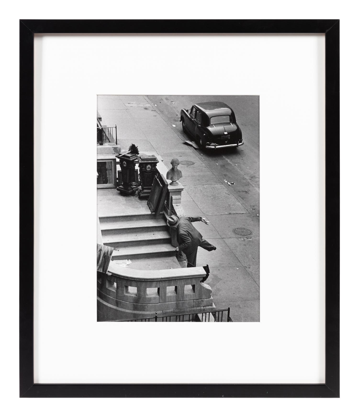 Ruth Orkin (1921-1985) Man Balancing on Stoop, West 88th Street, NYC, 1952