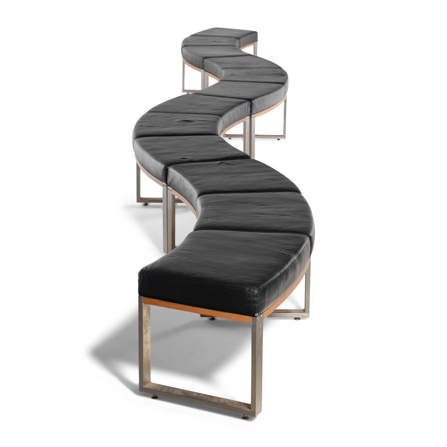 A Leather-Upholstered Elongated Serpentine Bench