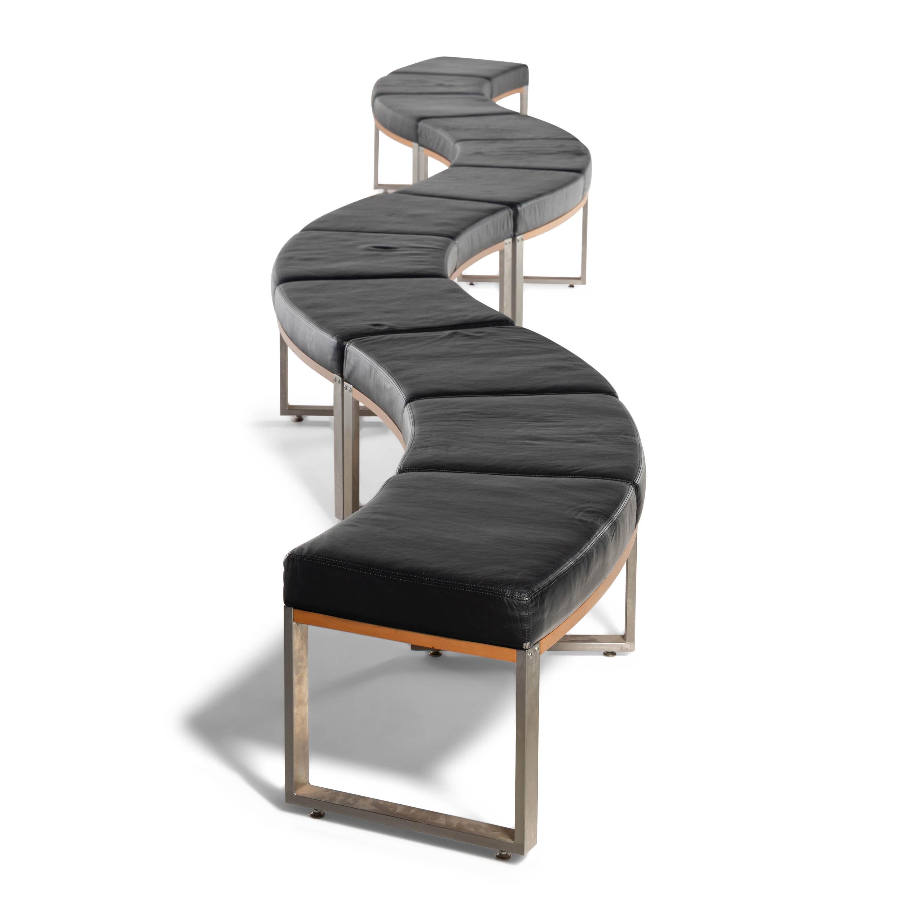 A Leather-Upholstered Elongated Serpentine Bench