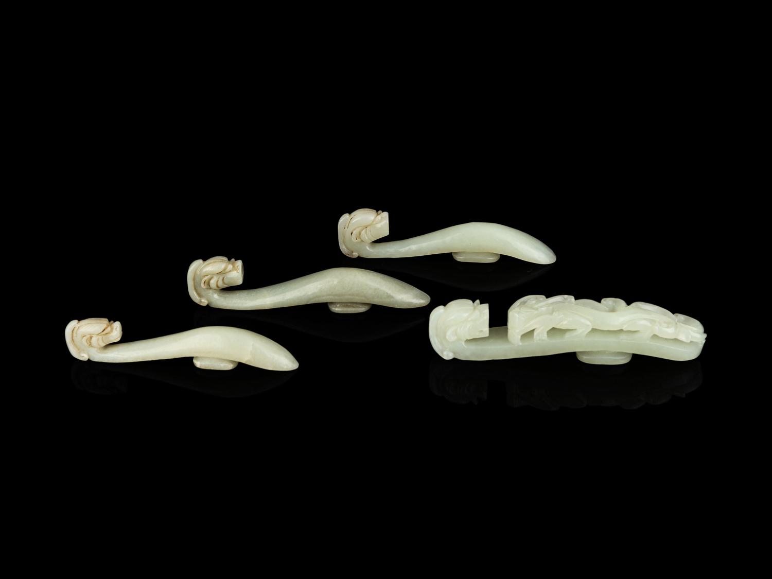 Four Chinese Celadon Jade 'Chilong' Belt Hooks