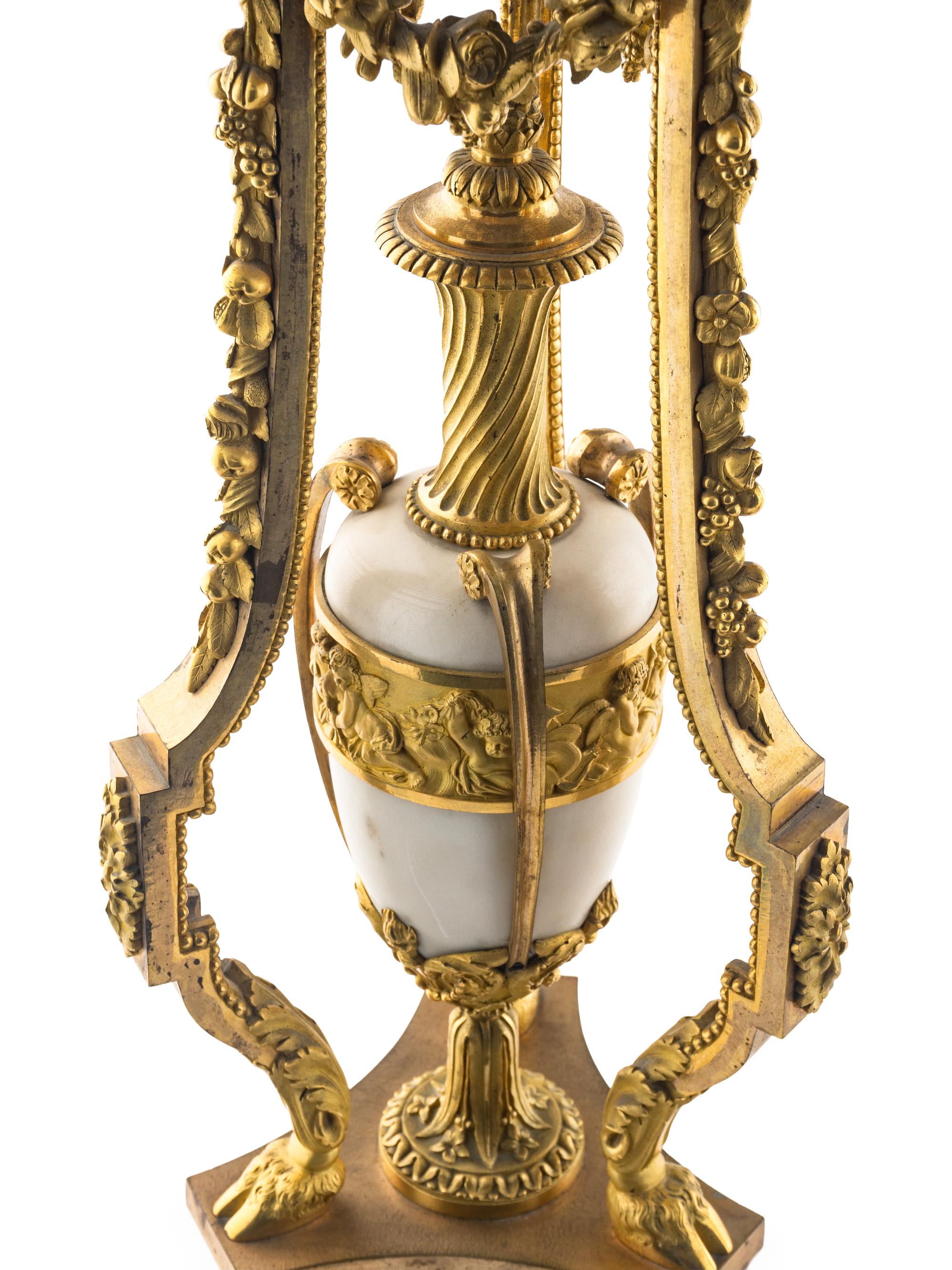 A Pair of Louis XVI Style Gilt Bronze and White Marble Ten-Light Candelabra