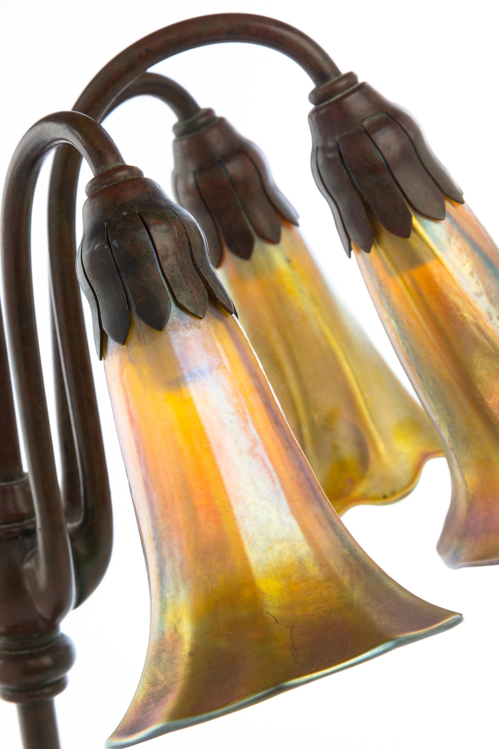 Tiffany Studios, a three-light Lily lamp