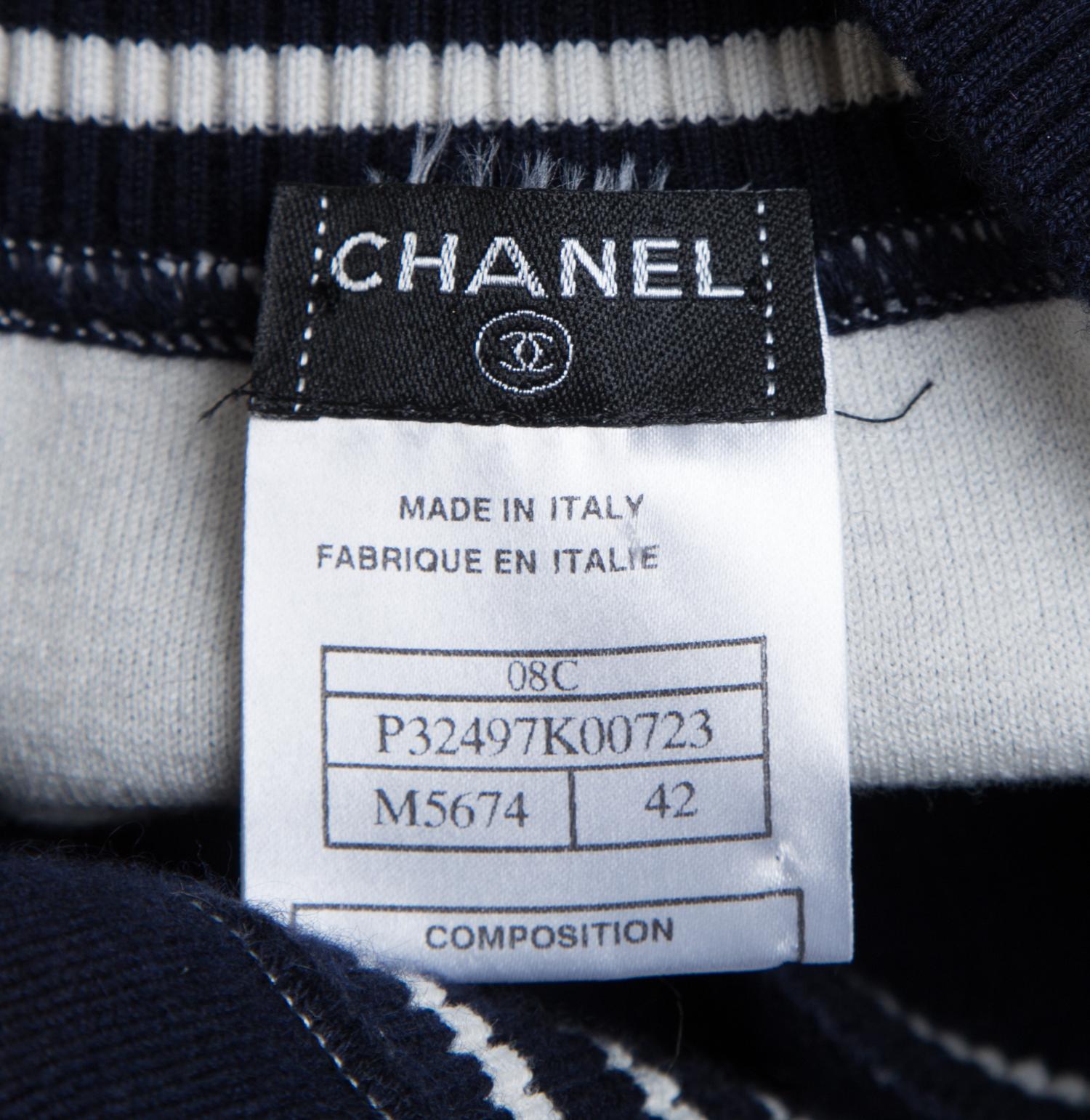 A Chanel Navy Three Piece Jacket and Skirt Ensemble, Jacket and skirt size 42, Top size 40.