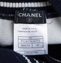 A Chanel Navy Three Piece Jacket and Skirt Ensemble, Jacket and skirt size 42, Top size 40.