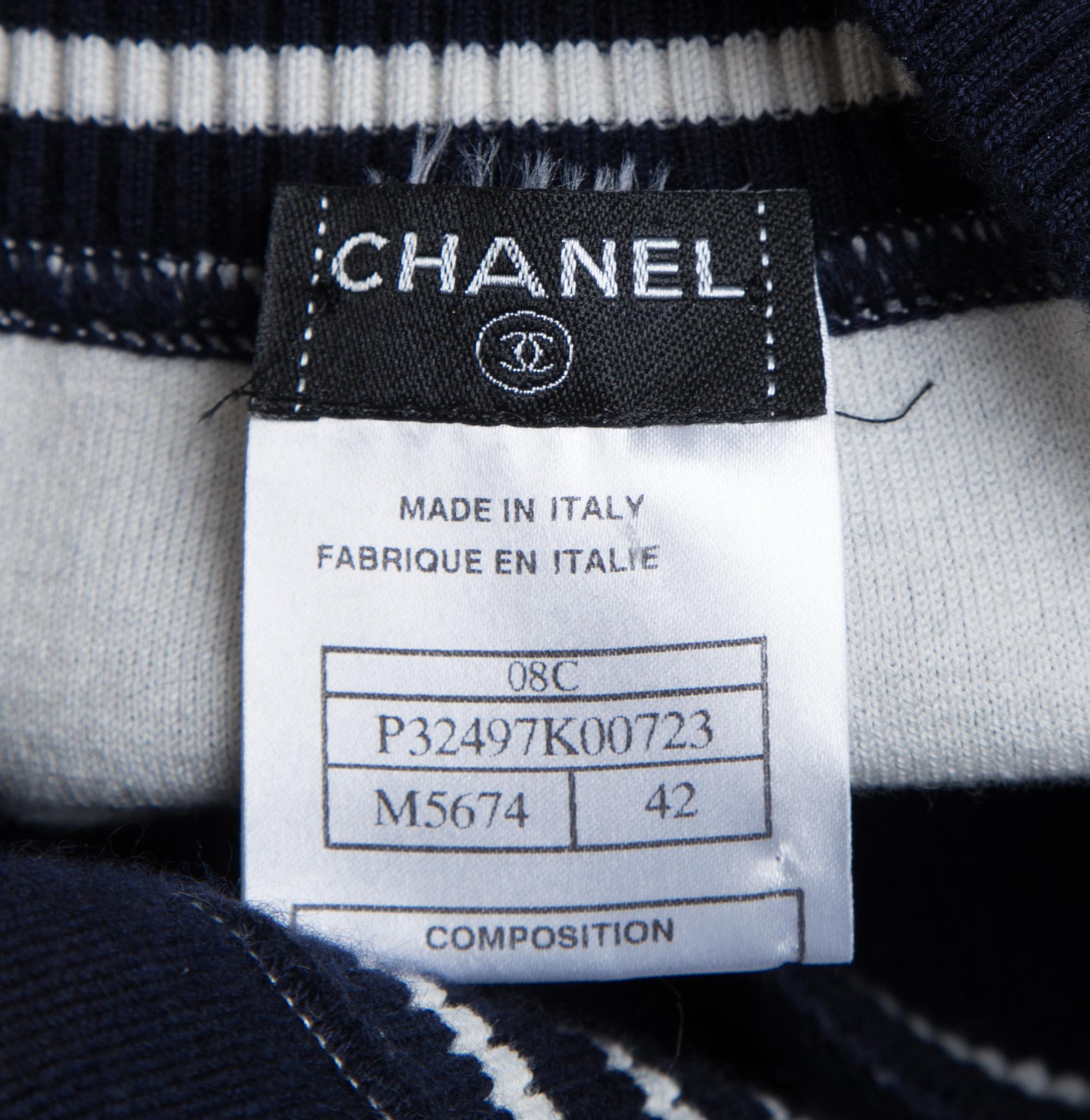 A Chanel Navy Three Piece Jacket and Skirt Ensemble, Jacket and skirt size 42, Top size 40.