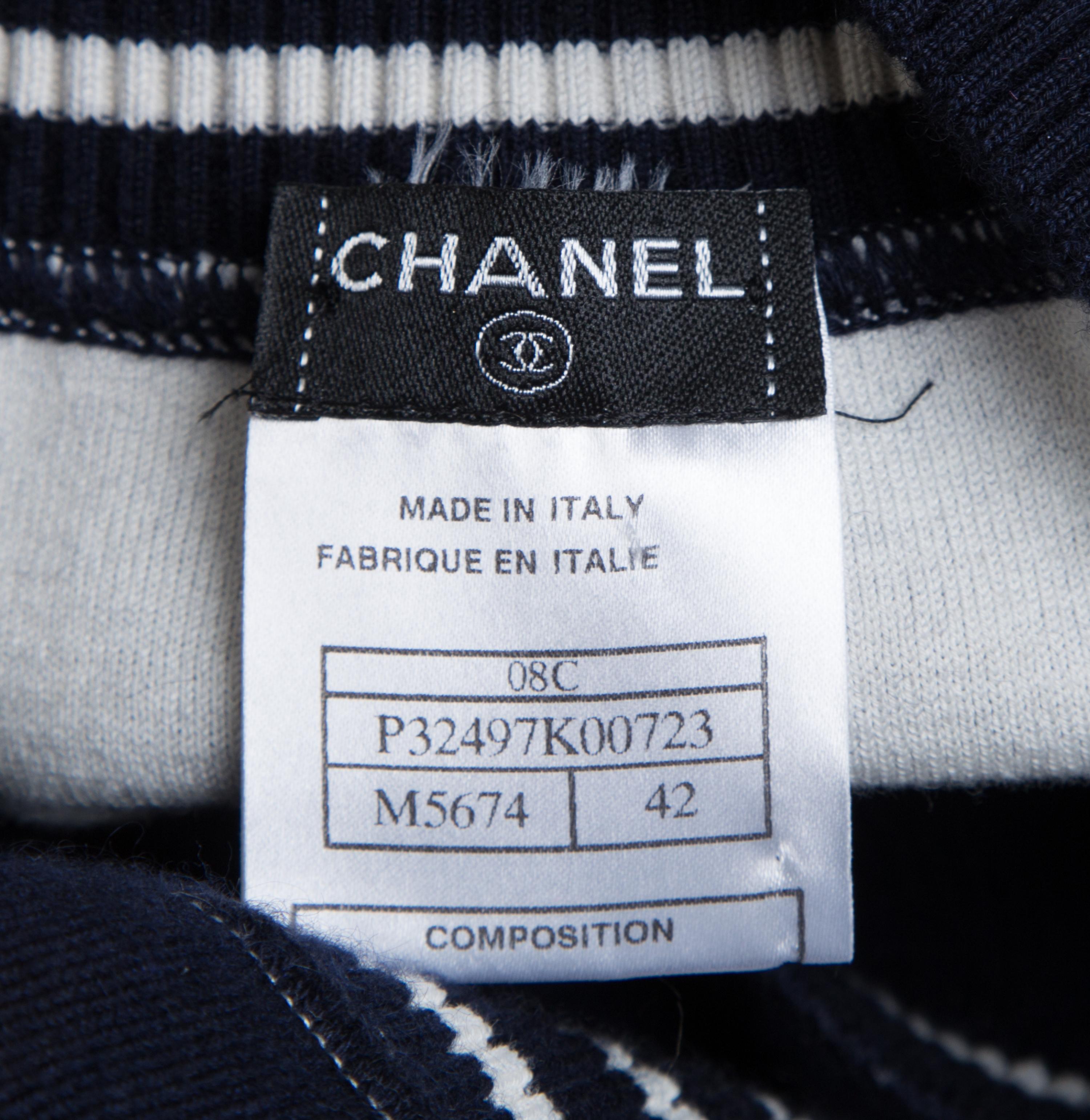 A Chanel Navy Three Piece Jacket and Skirt Ensemble, Jacket and skirt size 42, Top size 40.