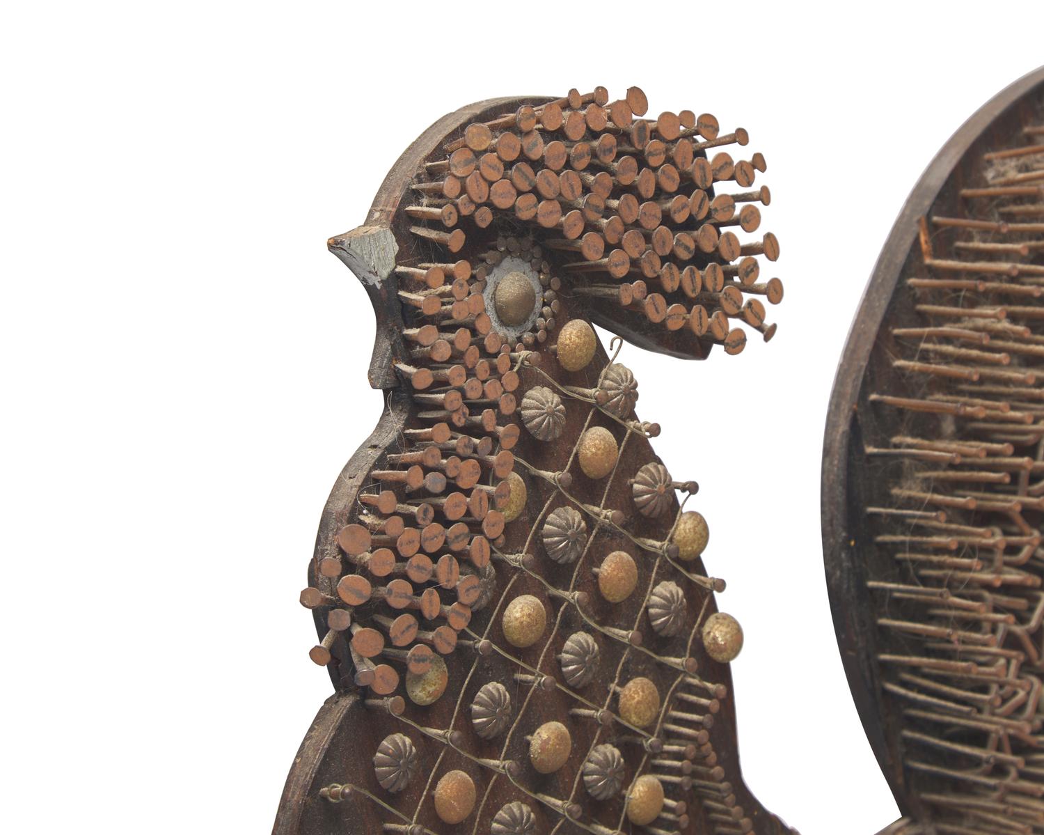 A Painted Wood and Nail-Work Rooster Plaque