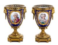 A Pair of Sevres Style Gilt Bronze Mounted Porcelain Urns Height 8 1/8 inches. — 19TH CENTURY