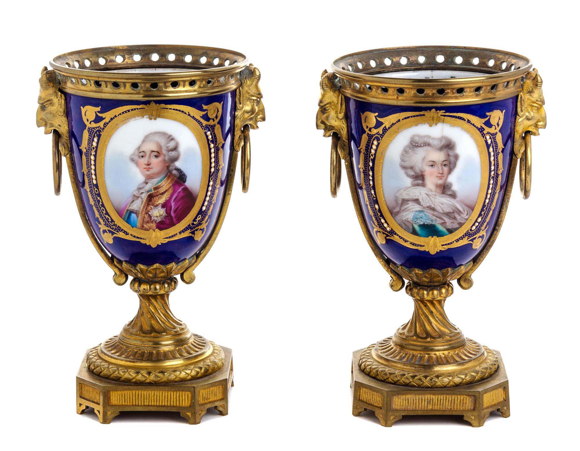 A Pair of Sevres Style Gilt Bronze Mounted Porcelain Urns Height 8 1/8 inches. — 19TH CENTURY