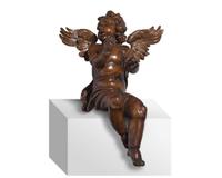 An Italian Baroque carved walnut angel, 17th century