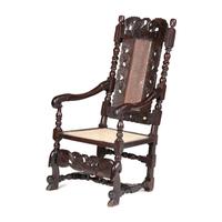 A William and Mary Swan-and-Leaf Carved and Cane Upholstered Oak Armchair