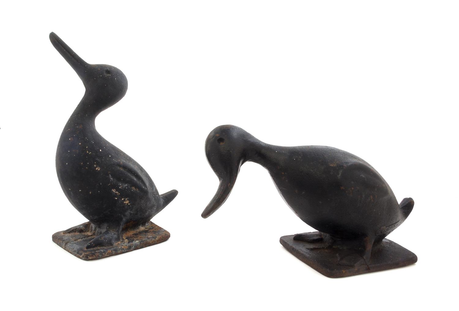 Two Cast Iron Doorstops Height of tallest 11 1/2 inches.