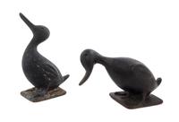 Two Cast Iron Doorstops Height of tallest 11 1/2 inches.