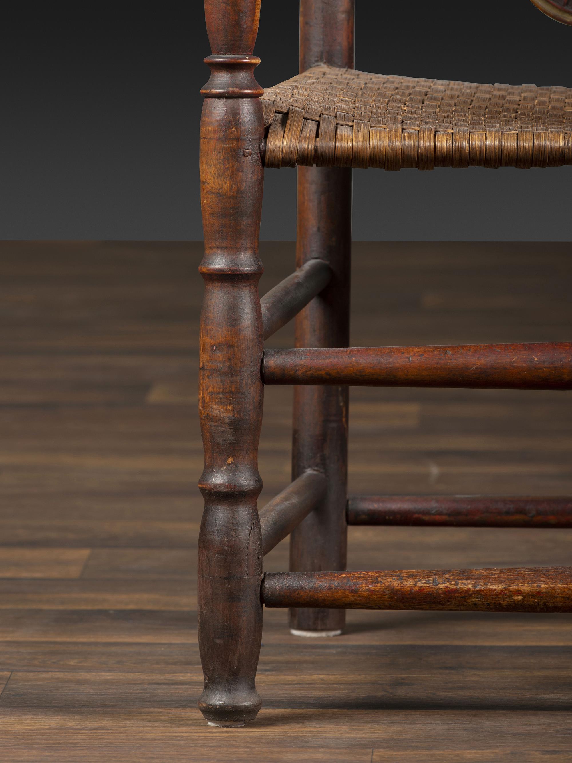 A William and Mary Style Parcel Gilt and Red Painted, Fan-Carved Bannister Back Woven Splint Seat Armchair