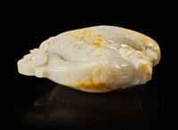 A large Chinese carved pale celadon and russet jade rhyton vessel 青白玉雕觥杯