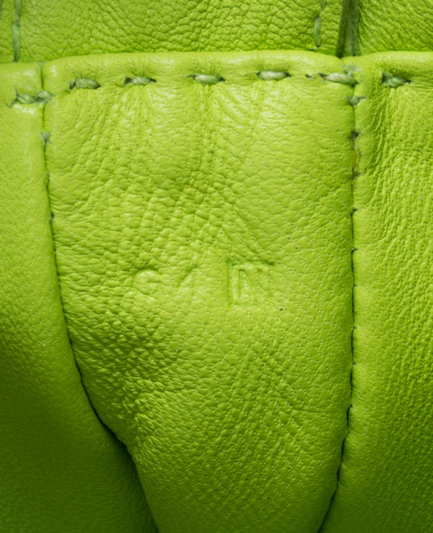 An Hermes Kiwi Agneau Clou de Selle Pouch, 6" x 9" x 1".