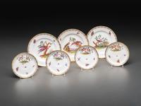 An English Parcel Gilt Bird and Insect Decorated Porcelain Partial Dinner Service