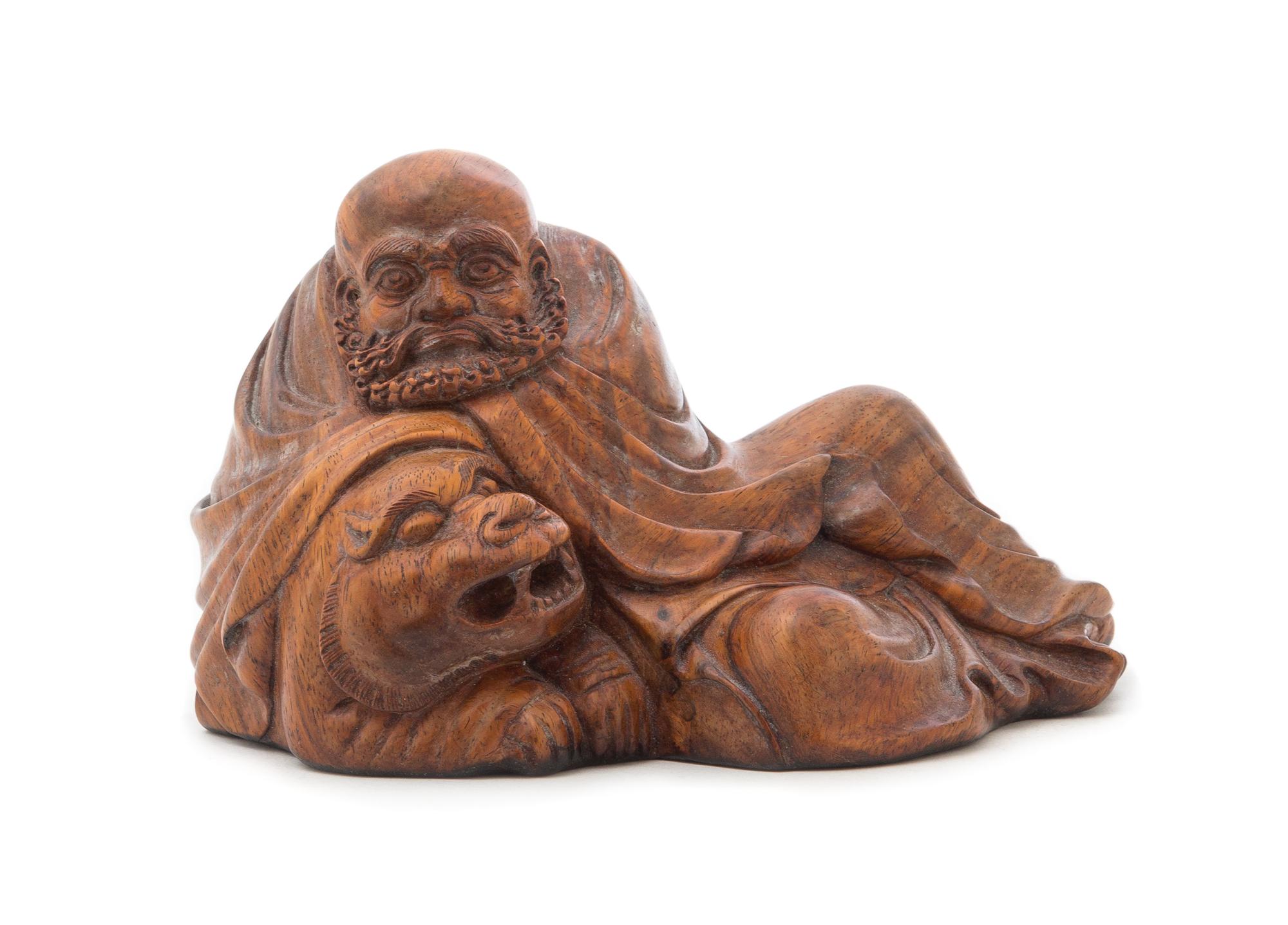 A Carved Wood Figural Group Length 5 inches.