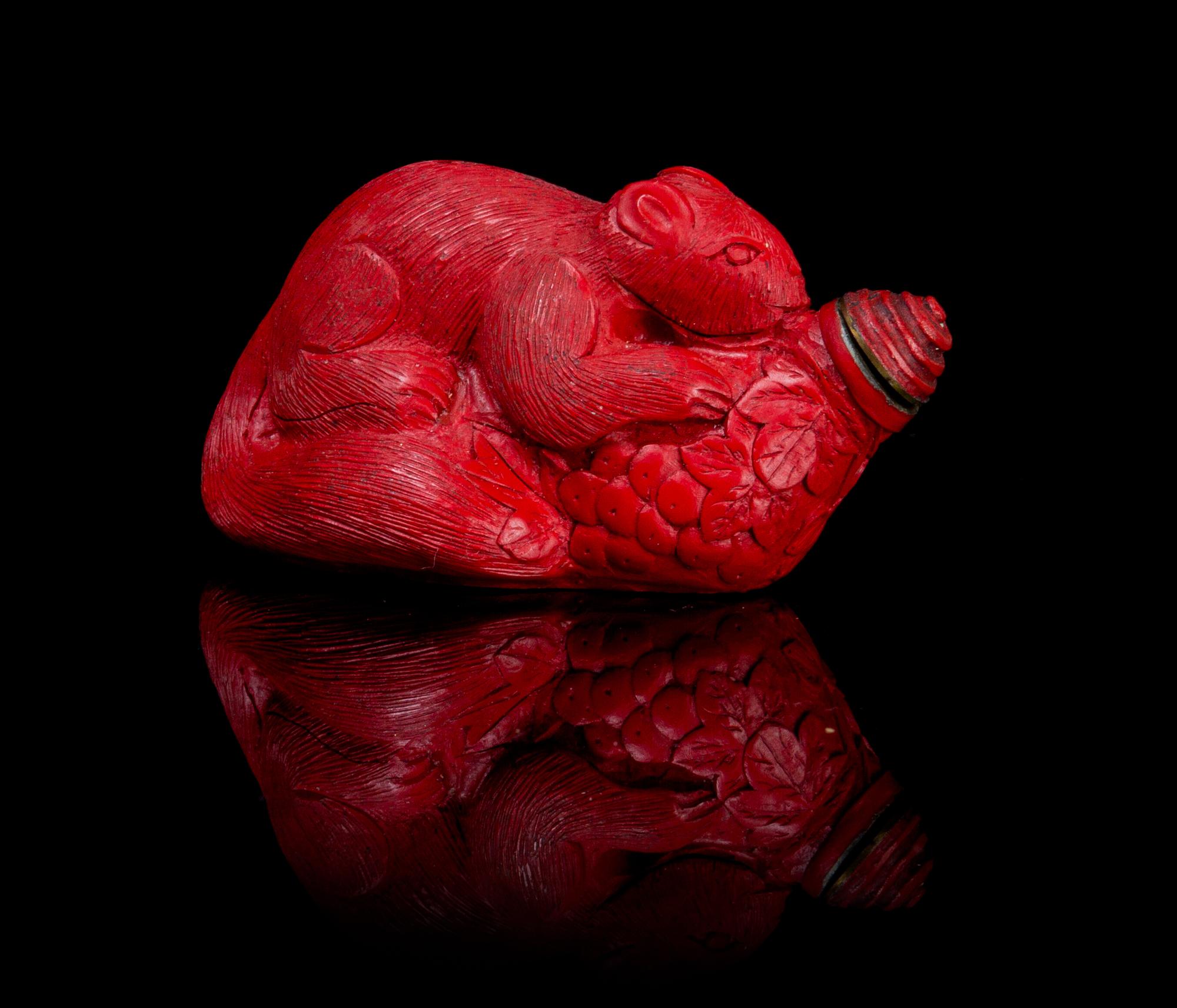 A Carved Cinnabar Lacquer Snuff Bottle Length 3 inches.