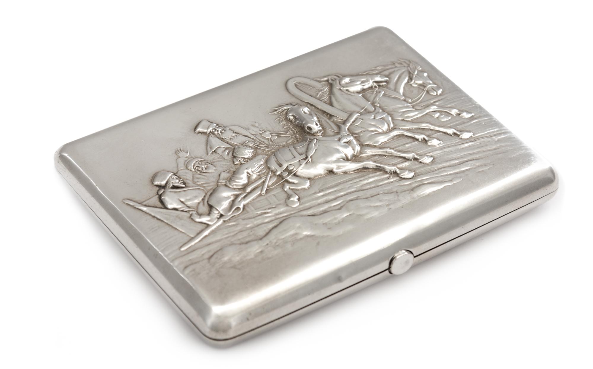 A Russian Silver Cigarette Case, Mark of Ivan Kaltikov, Moscow, the lid with a repousse decorated troika scene, the underside and inter