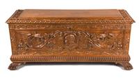 A Continental Carved Walnut Blanket Chest Height 21 1/2 x width 47 3/4 x depth 17 inches. — 20TH CENTURY