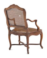 A Régence Carved Walnut and Caned Fauteuil