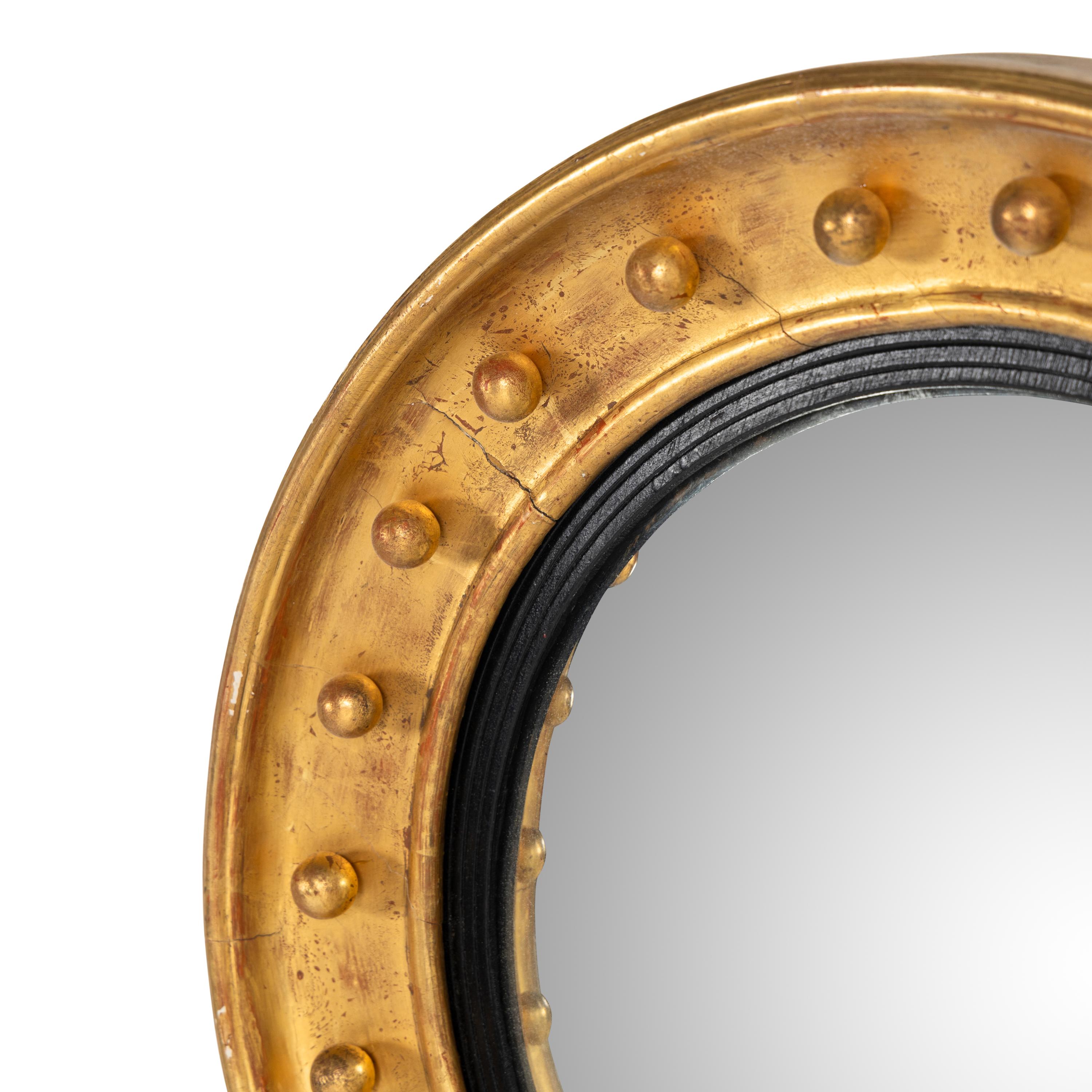 A Regency Style Giltwood Convex Mirror