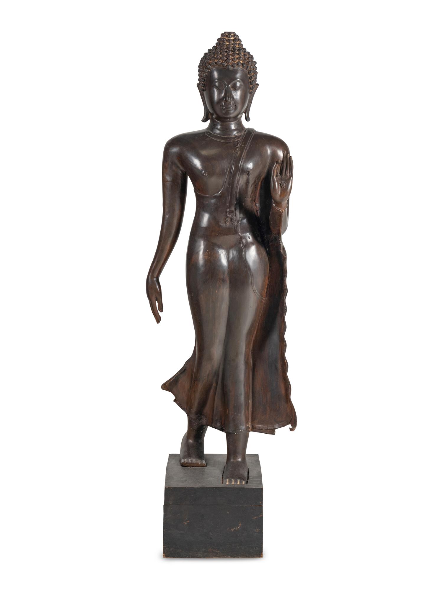 A Large Thai Bronze Figure of Walking Buddha