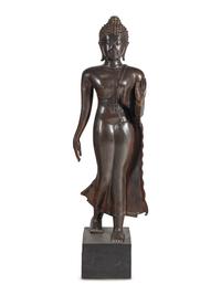 A Large Thai Bronze Figure of Walking Buddha