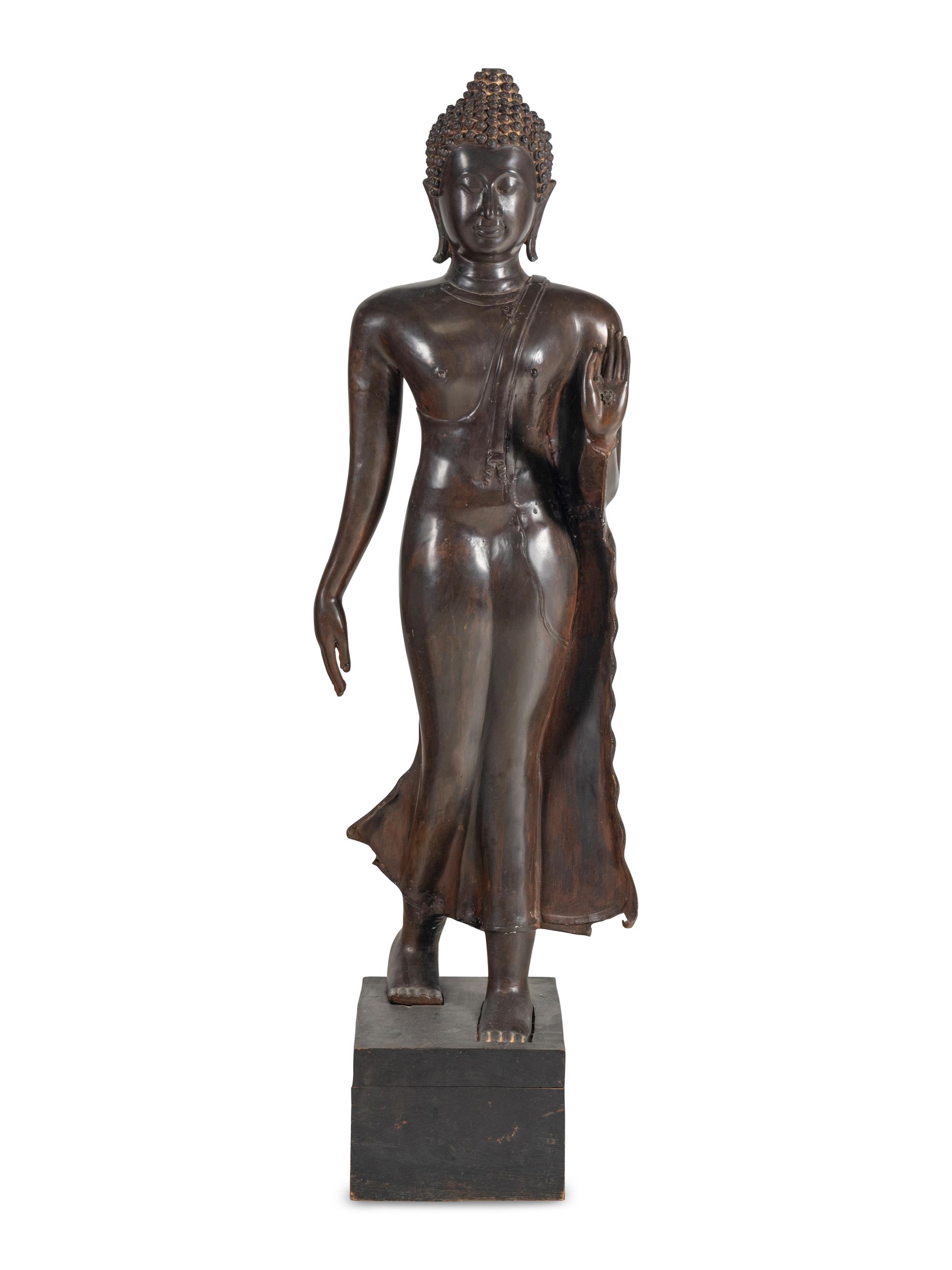 A Large Thai Bronze Figure of Walking Buddha