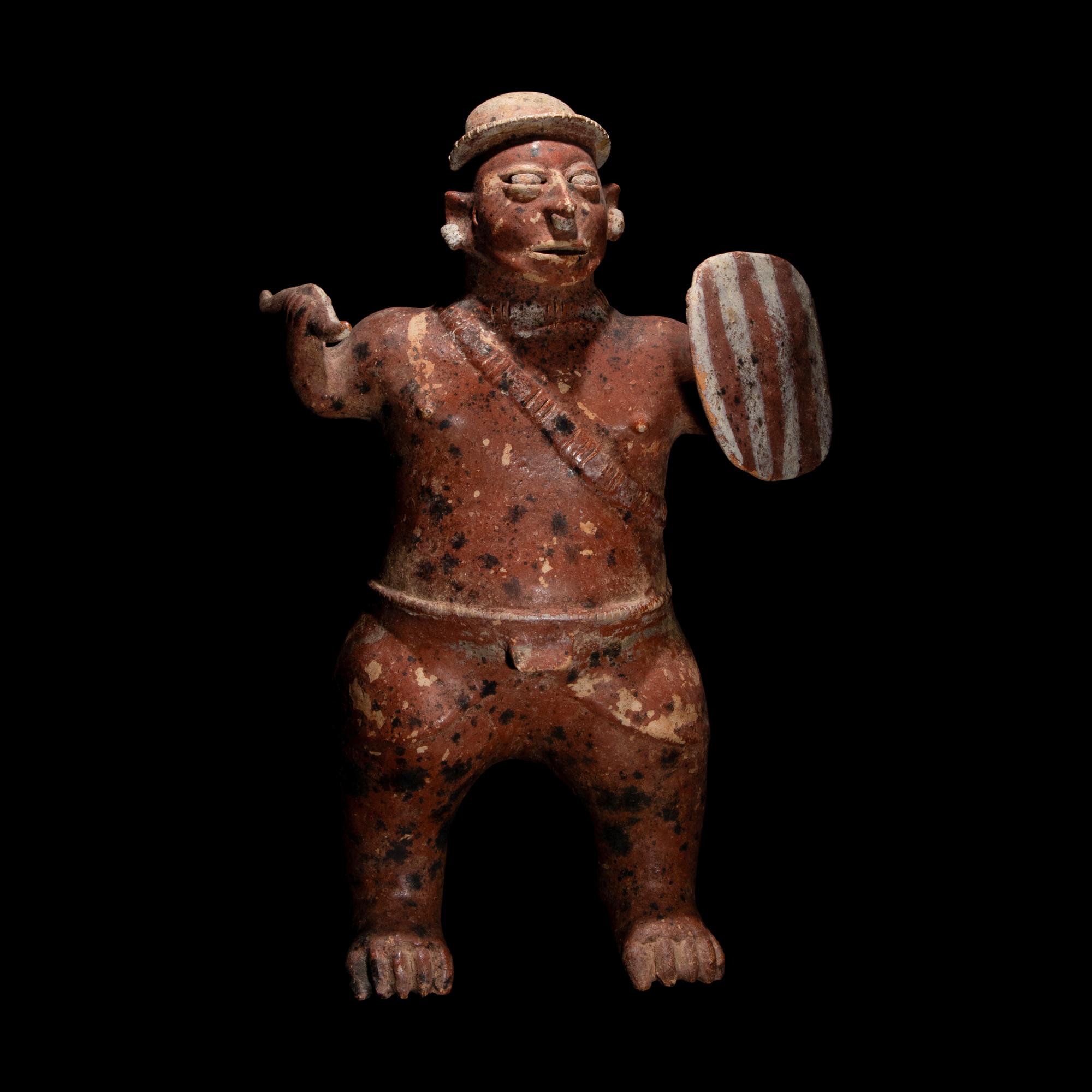 A Colima Painted Terracotta Standing Warrior