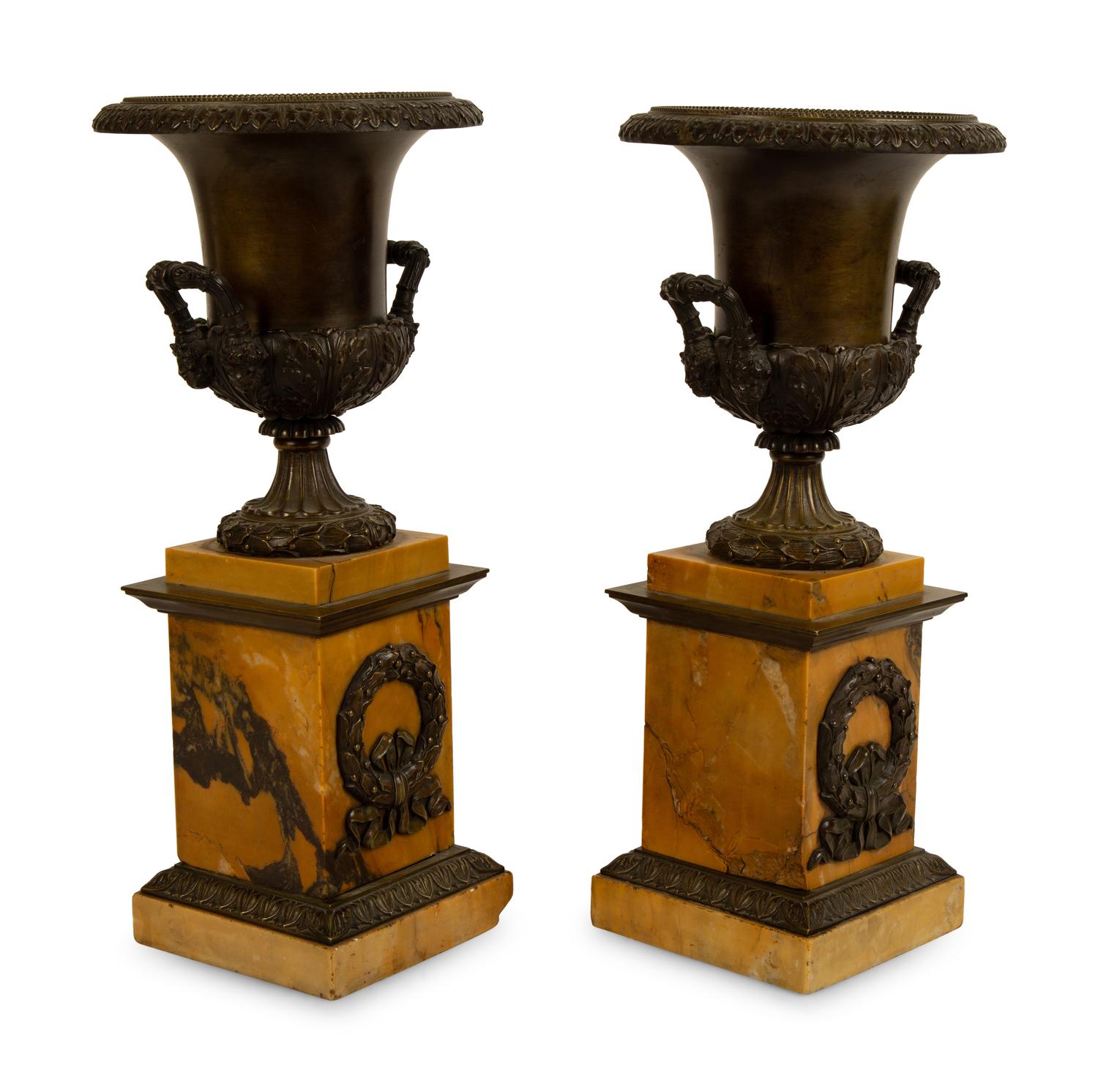 A Pair of French Bronze Urns on Marble Bases — 19TH/20TH CENTURY
