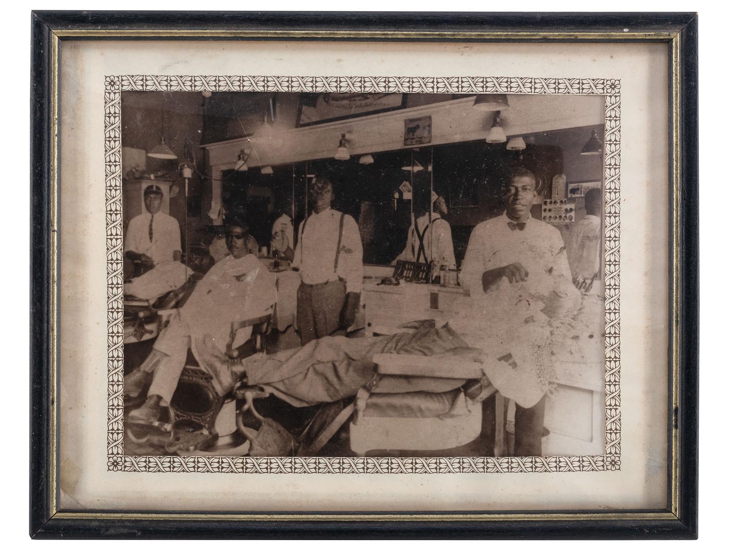 [EARLY PHOTOGRAPHY]. A group of 12 occupational photographs highlighted by a tintype of railroad workers including an African American subject.