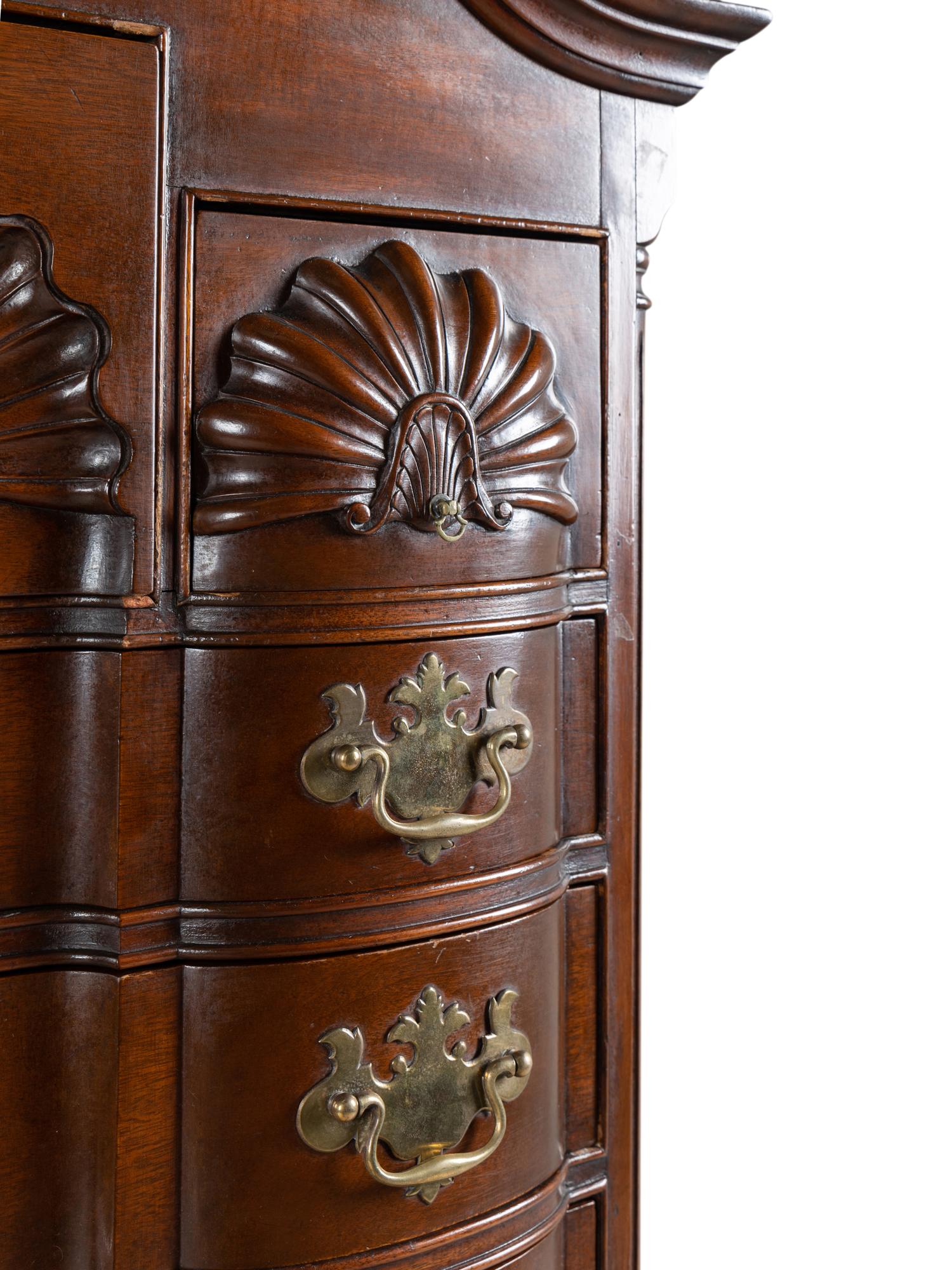 A Chippendale Style Shell and Rosette Carved Mahogany Block Front Chest-On-Chest