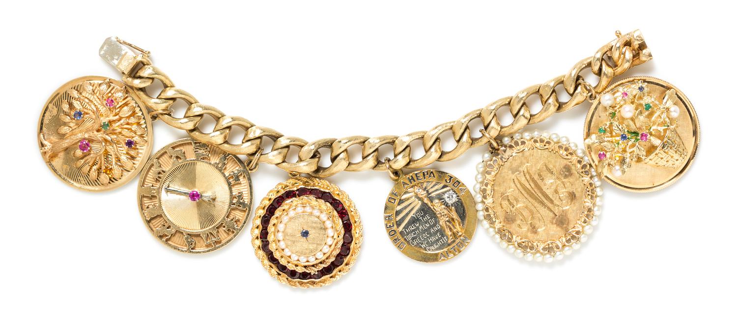 A Yellow Gold Charm Bracelet with 6 Attached Charms, 96.50 dwts.