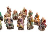 A Set of Eighteen Chinese Export Enameled Porcelain Figures of Immortals