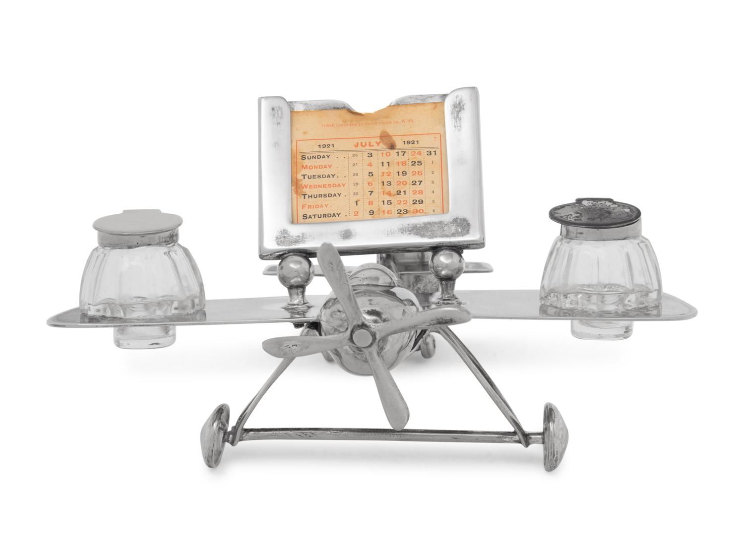 A Silver-Plate Airplane Form Ink-Well and Desk Calendar