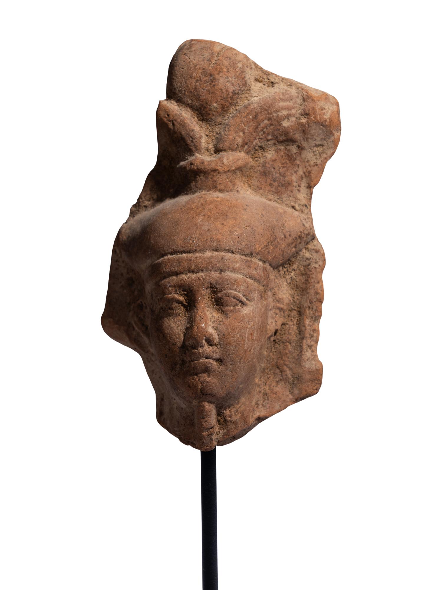 An Egyptian Terracotta Head of the God Osiris
