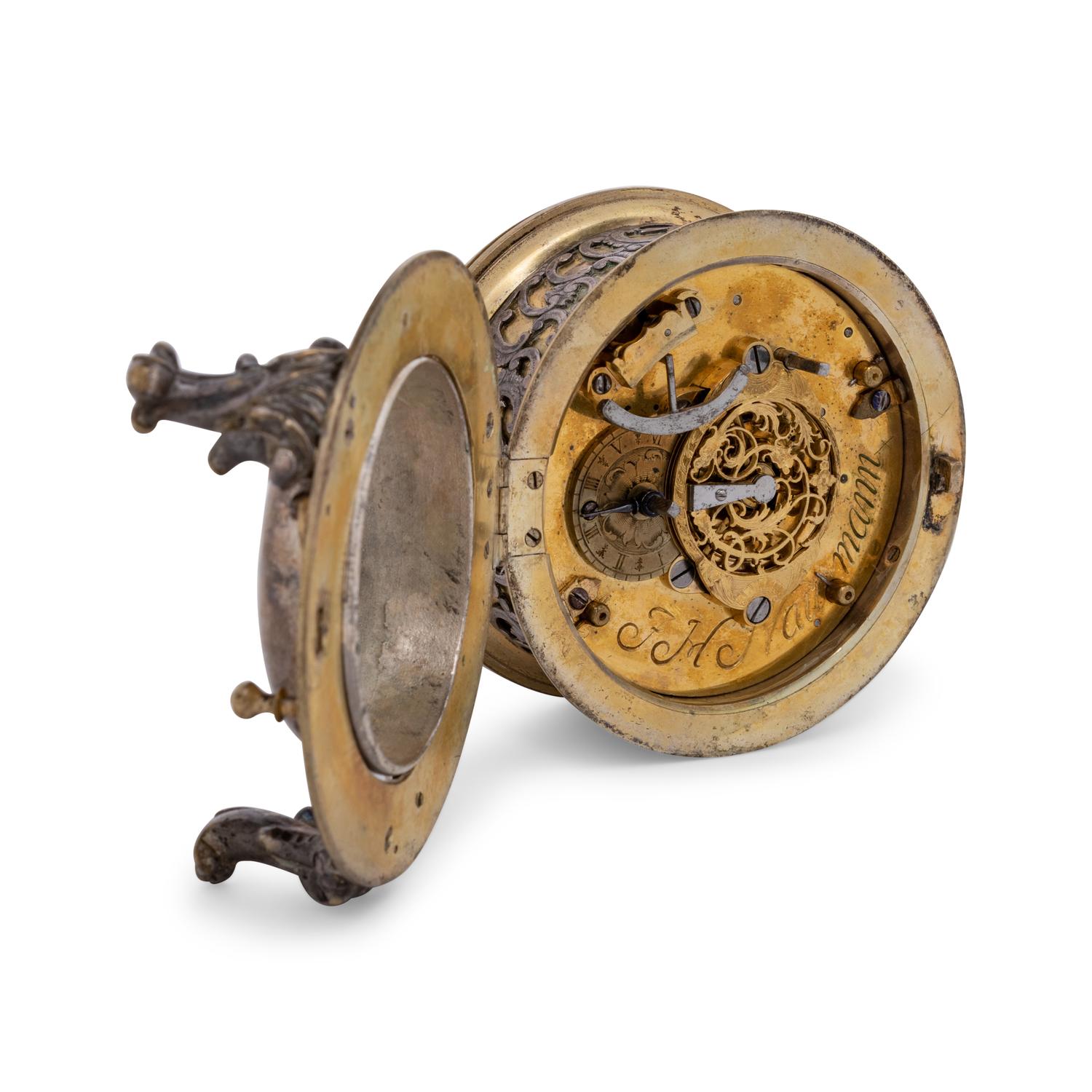 A German Gilt Metal and Silvered Brass Table Clock