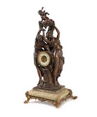 A Continental Cast Metal and Onyx Figural Mantel Clock