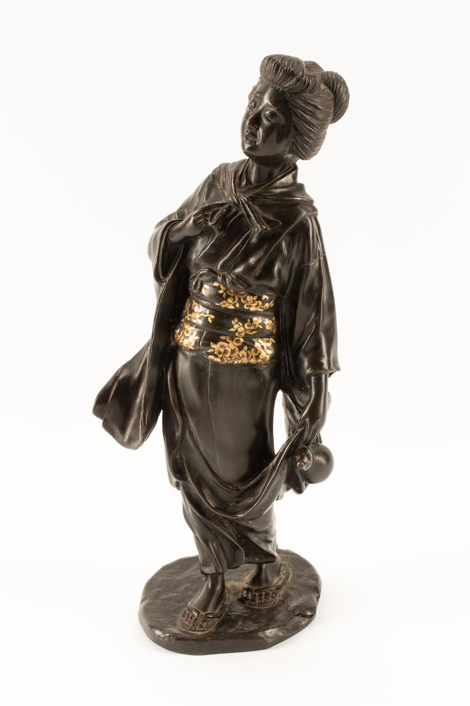 A Japanese Parcel Gilt Bronze Figure of a Lady