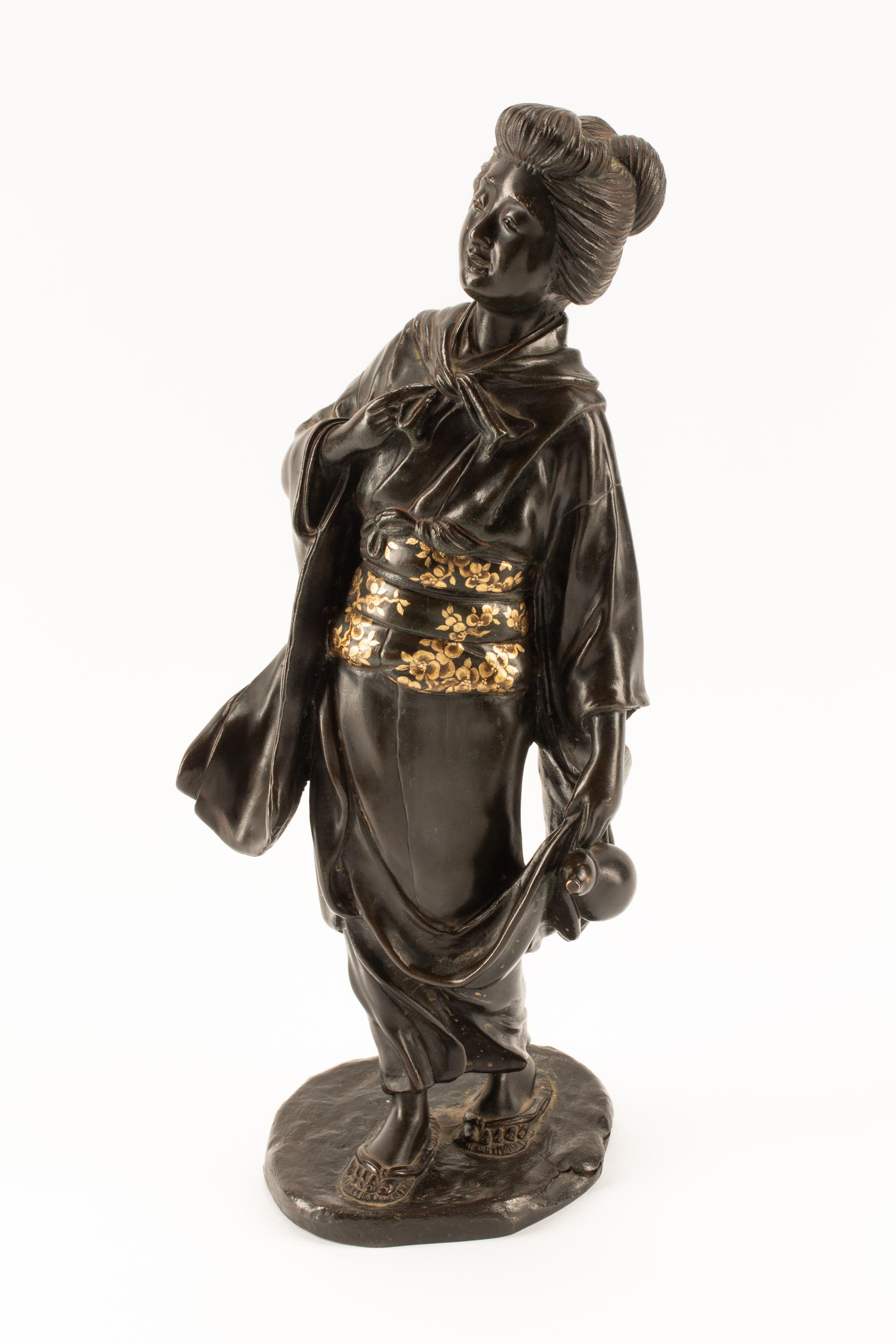 A Japanese Parcel Gilt Bronze Figure of a Lady