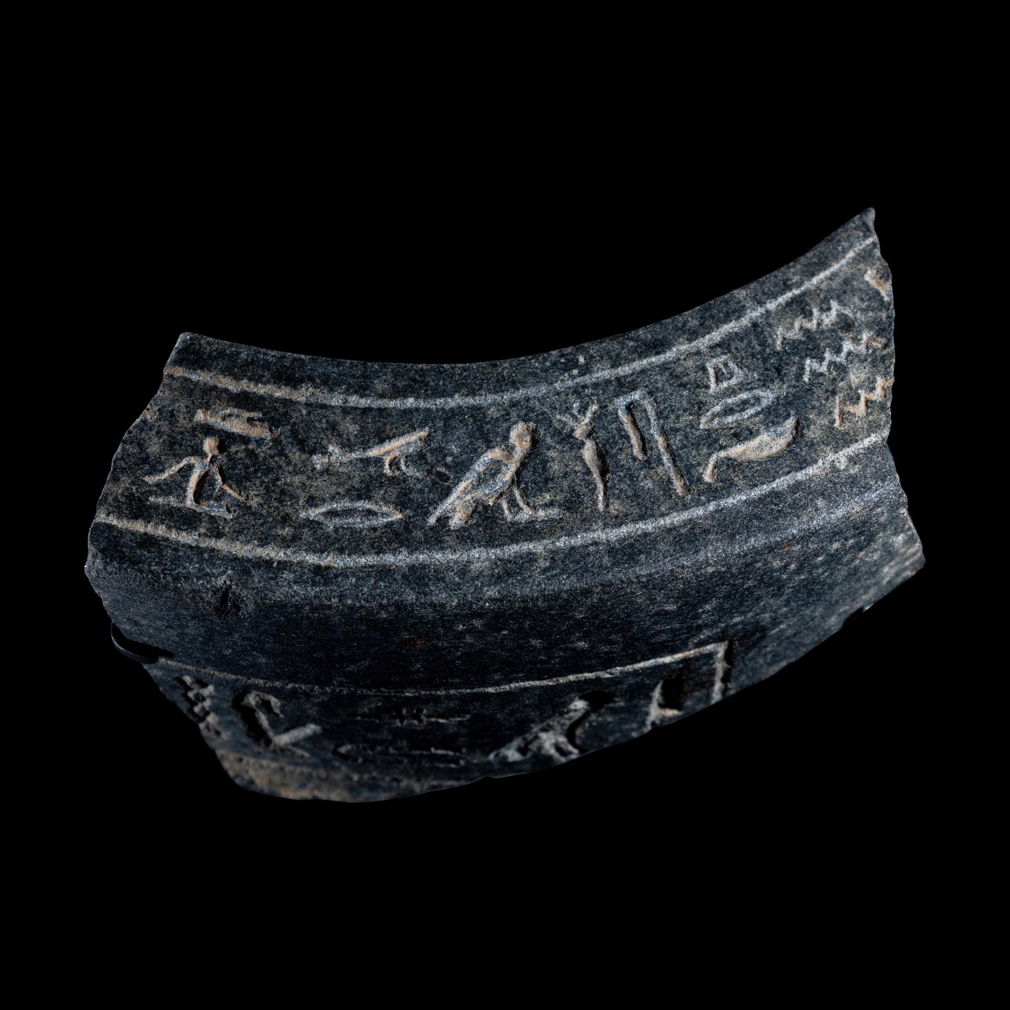 An Egyptian Granite Vessel Fragment with Hieroglyphs