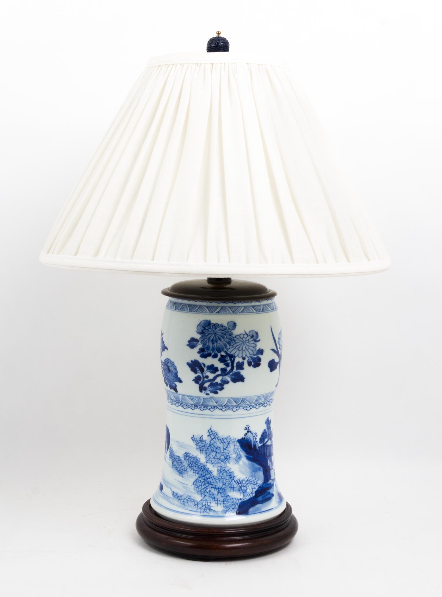 A Pair of Chinese Blue and White Porcelain Vases Height overall 24 1/2 inches.