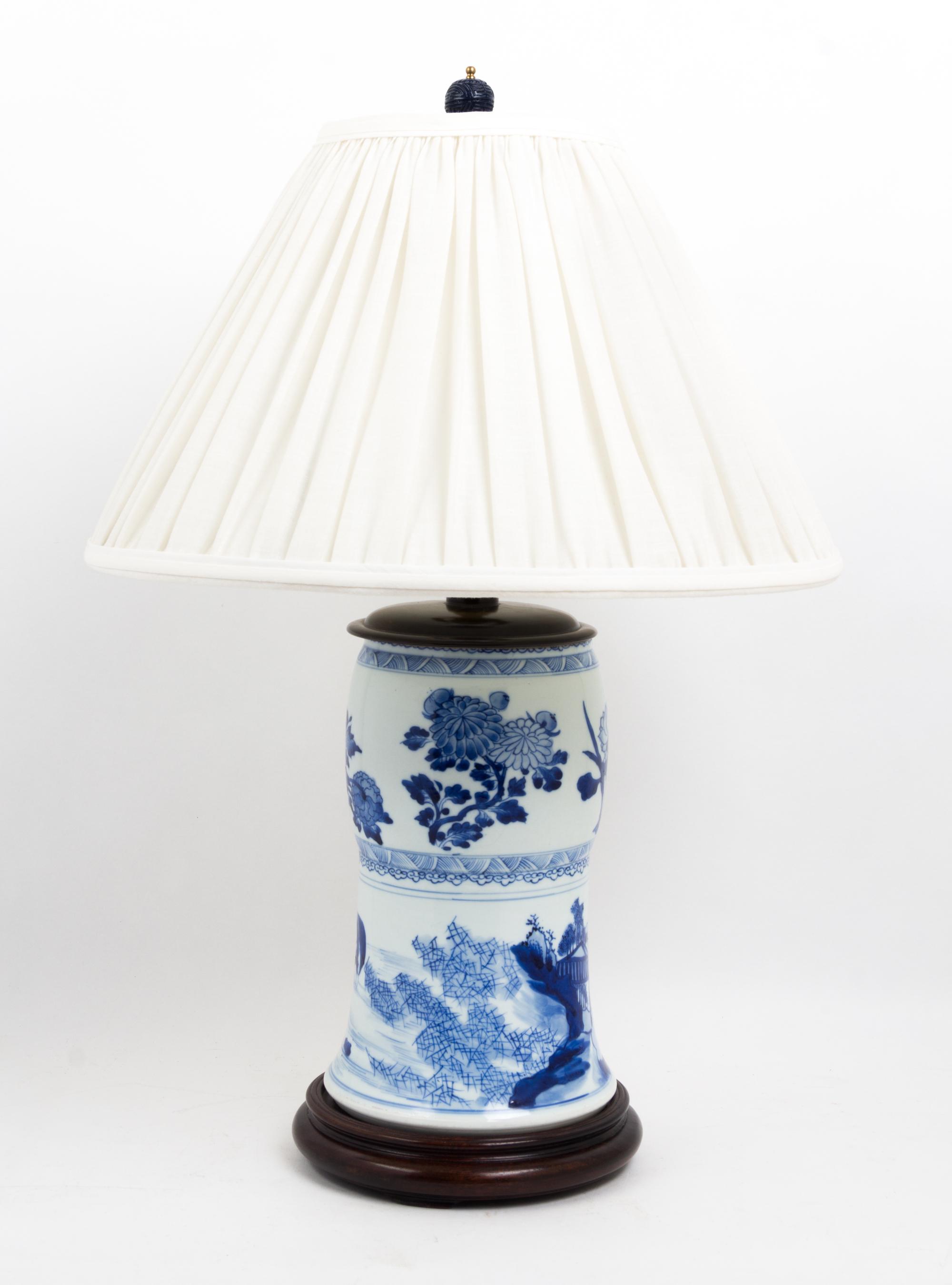 A Pair of Chinese Blue and White Porcelain Vases Height overall 24 1/2 inches.
