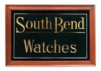 A Reverse Paint and Parcel Gilt South Bend Watches Advertising Sign
