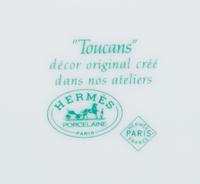 An Hermès Porcelain Toucans Porcelain Dinner Service